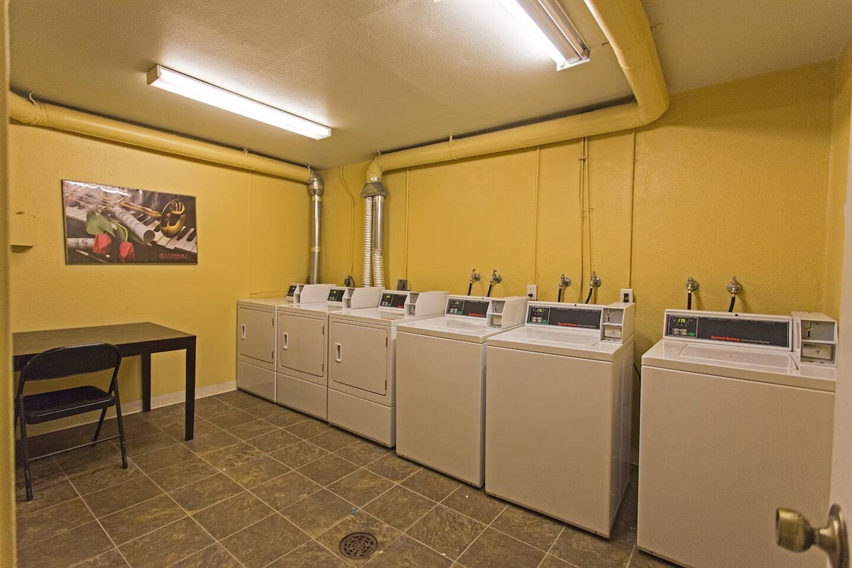 Coin laundry room located just across from unit.