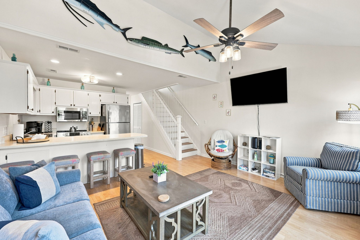 Unwind after a day in the sun with plenty of seating, beach-inspired decor, and a smart TV.