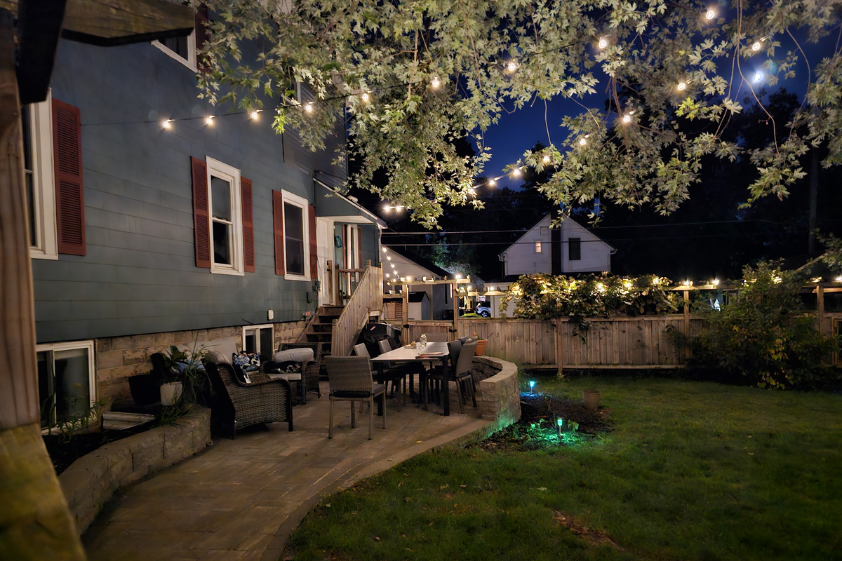 Private and spacious fenced yard is a lovely place to come together during the day and at night.