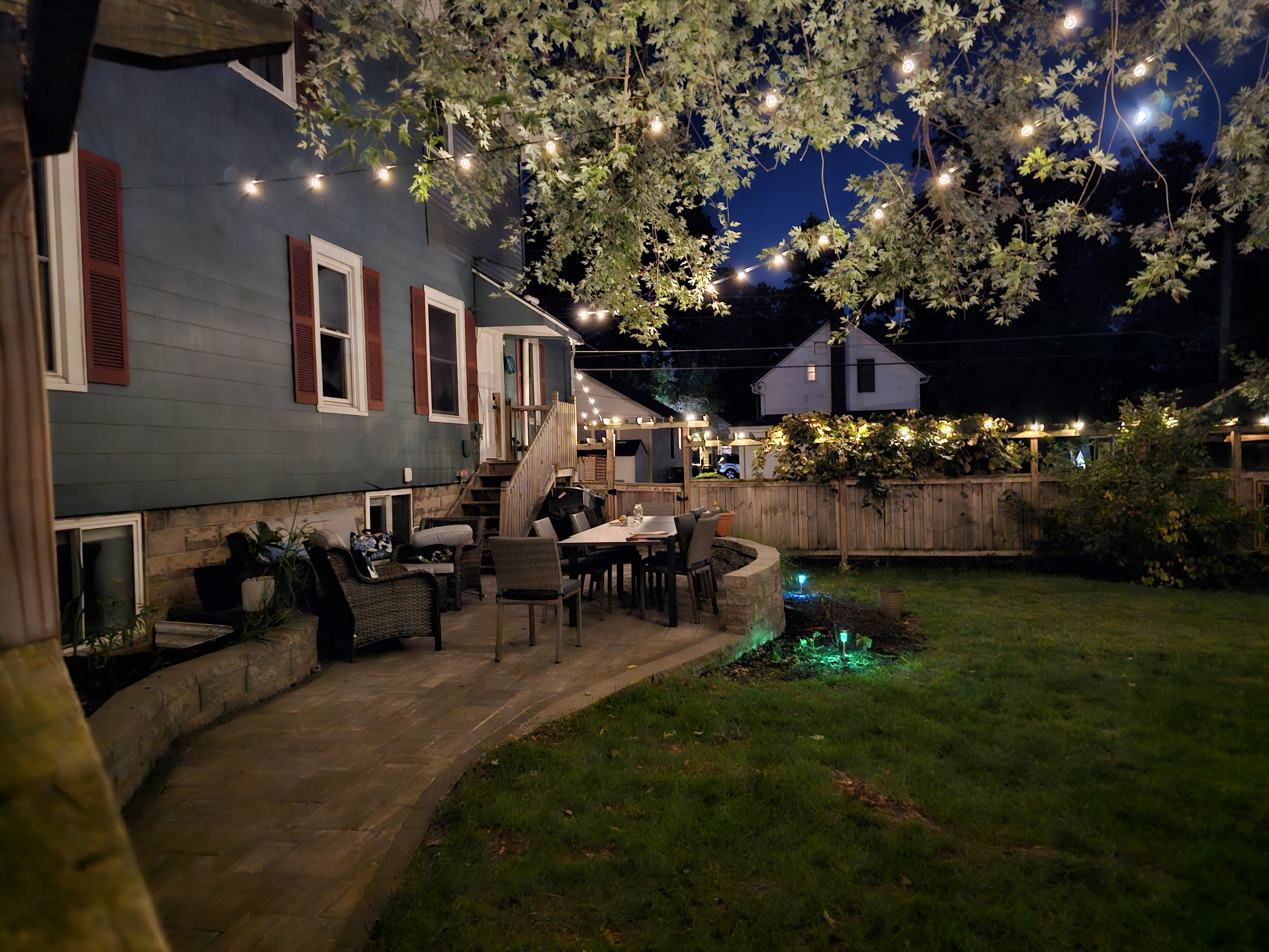 Private and spacious fenced yard is a lovely place to come together during the day and at night.