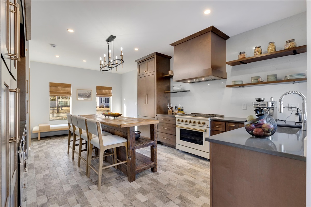 The kitchen has all essentials and great to gather around the Island Table. 