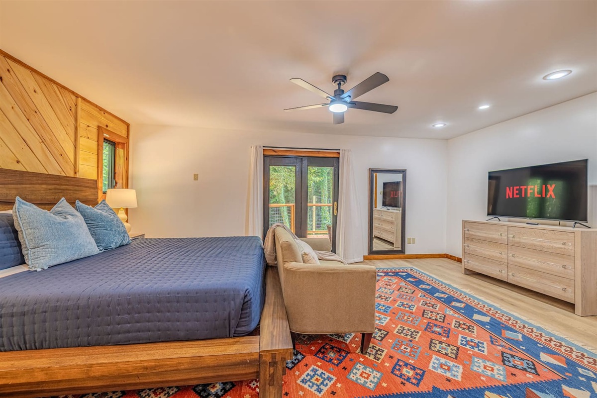 Unwind in bed with your favorite show on the Smart TV, then step directly onto the deck to breathe in the fresh mountain air.