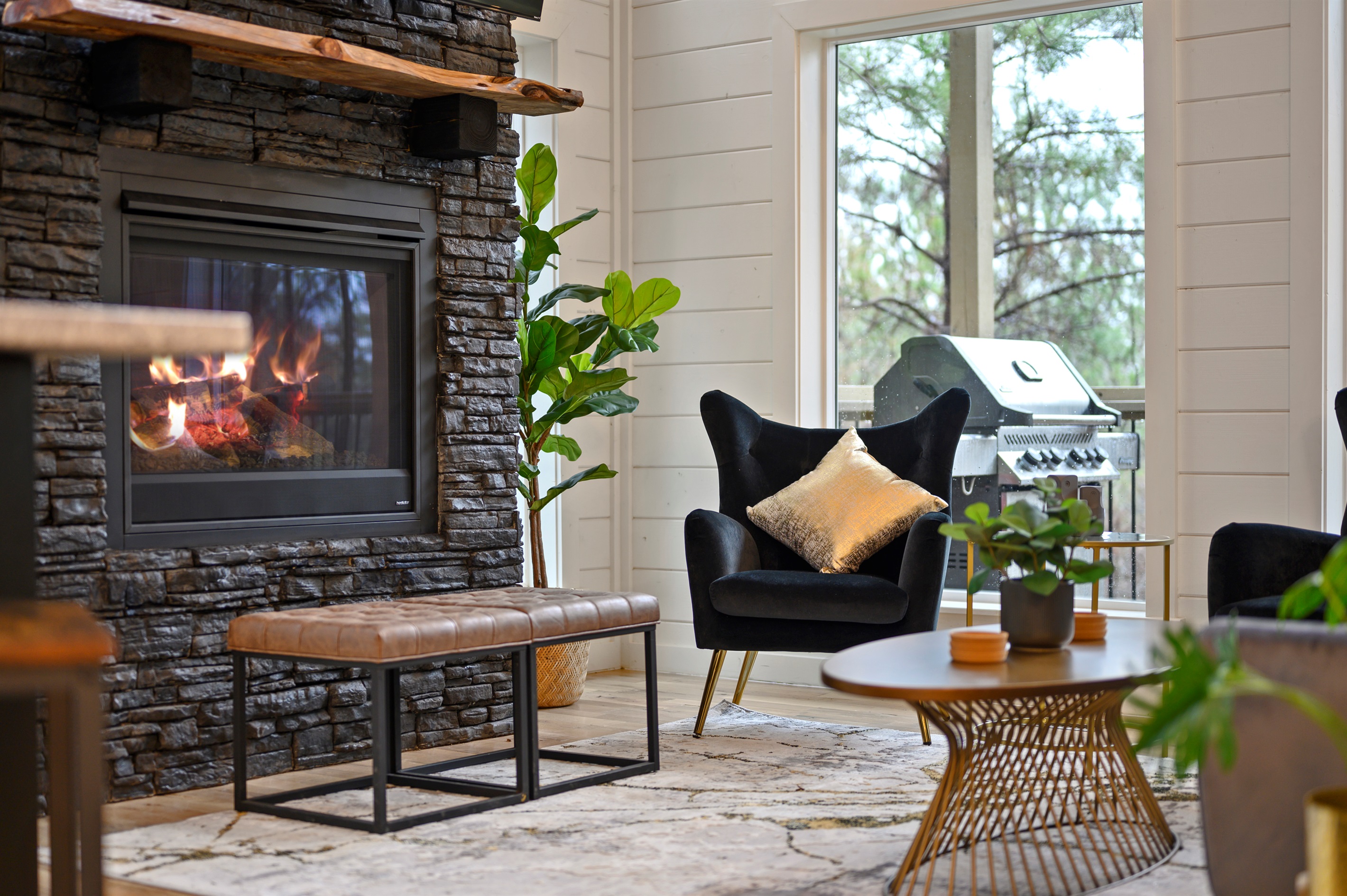 Spacious hangout area with comfortable seating and a TV, ideal for unwinding together.