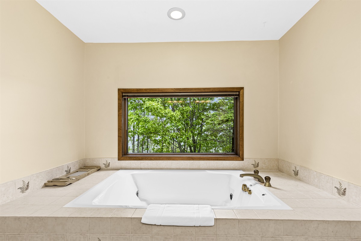 Soak up the sun and the suds in this large jetted bathtub.