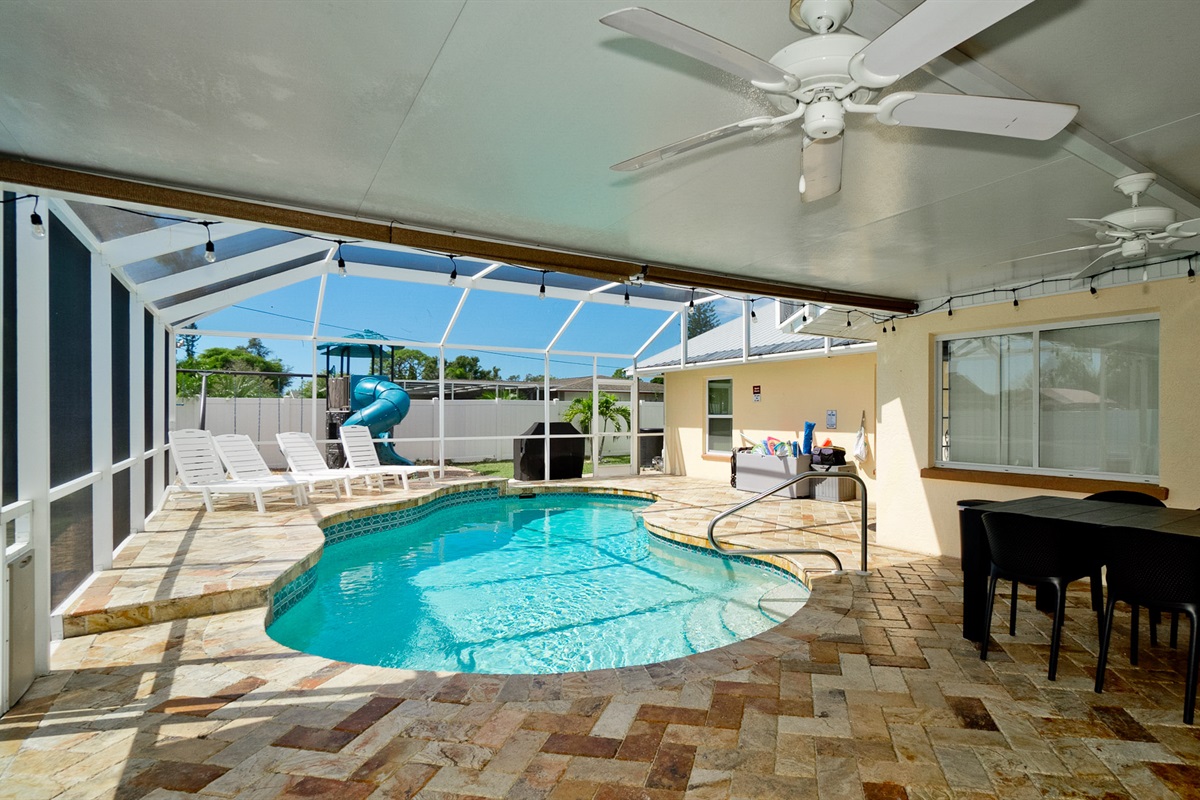 Endless outdoor fun for the whole family! Let the little ones play and explore the swings and slide while you relax by the sparkling caged pool just steps away.