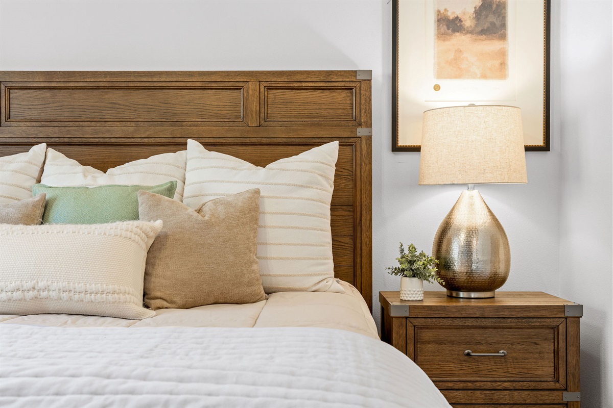 Warm wood accents and inviting, hotel-quality linens.