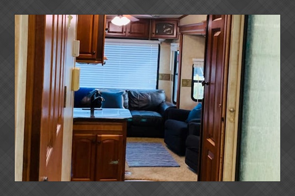 Between bedroom and kitchen/living room.