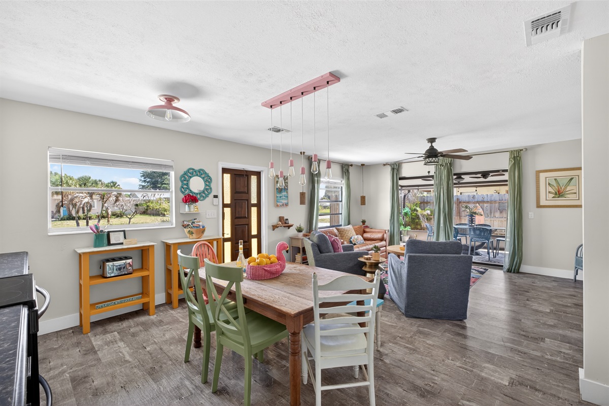The living room has an open floor plan with adjacent kitchen and dining area.