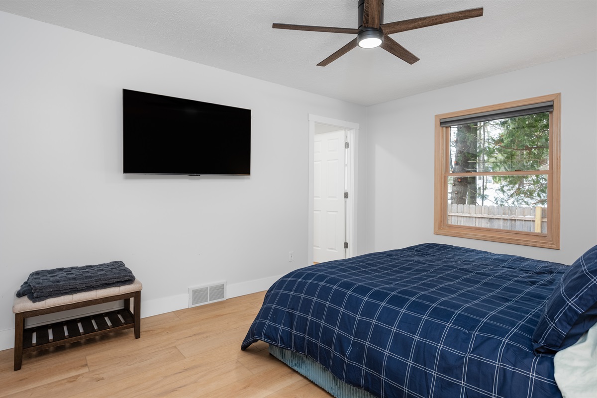 Main-level king room with TV