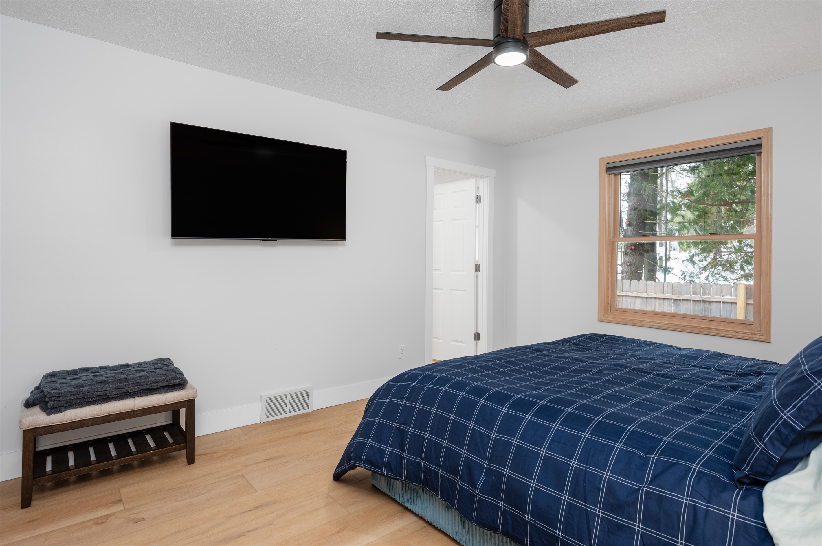 Main-level king room with TV