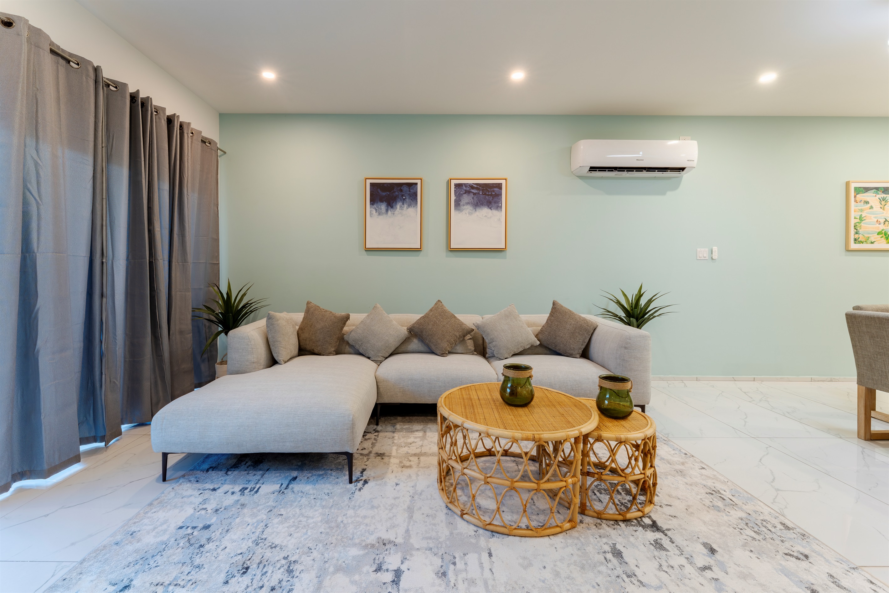 Relaxing Living Room with Plush Sectional & Rattan Coffee Table