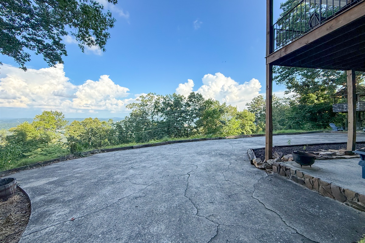 A large parking pad located around the back of the home provides ample space for multiple vehicles.