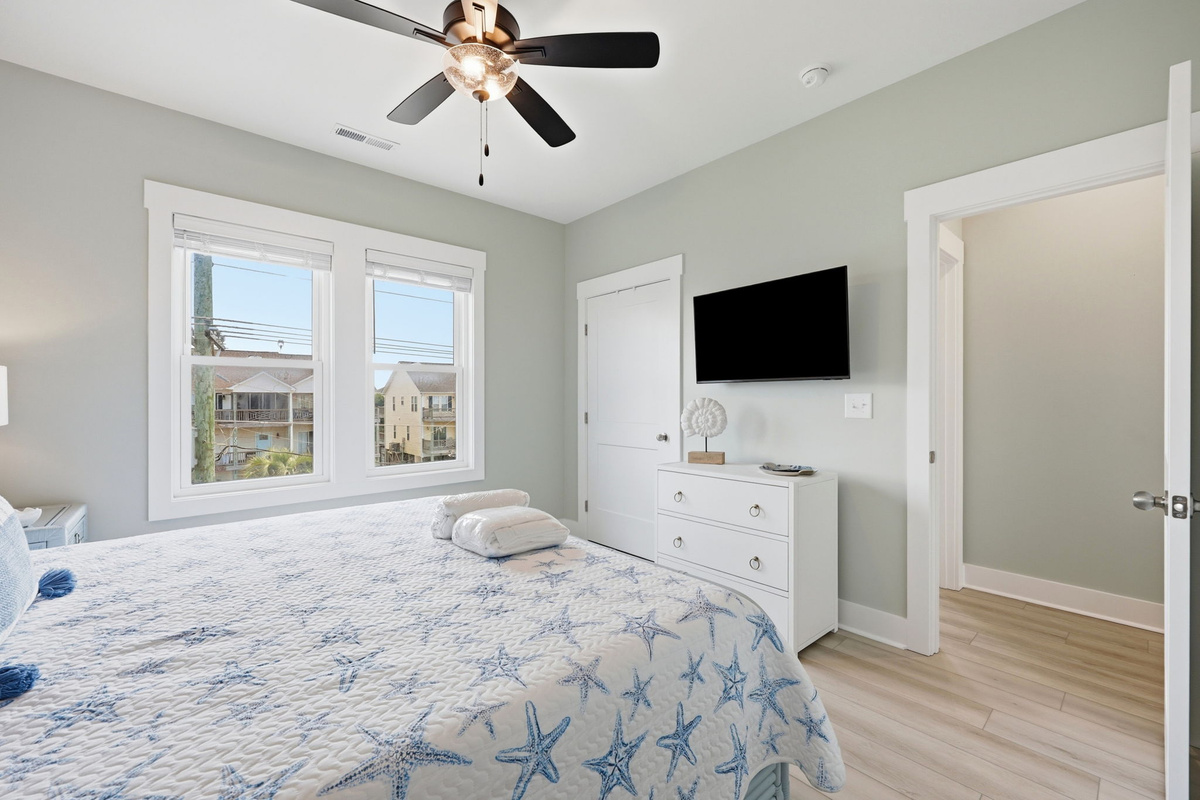 Wake up refreshed in this bright king bedroom, complete with a Smart TV, generous storage, and easy access to the adjacent full bathroom