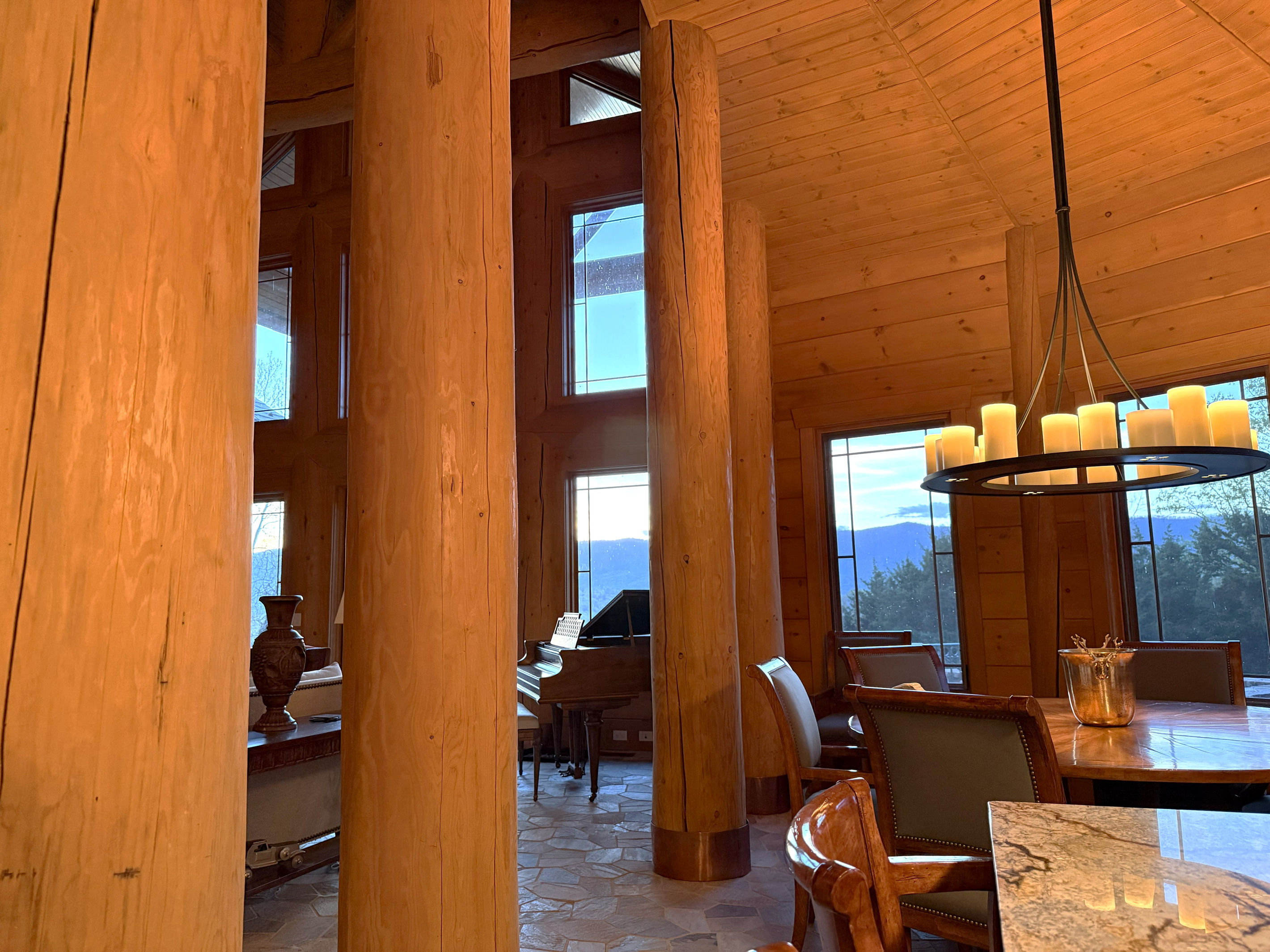 Soaring vaulted ceilings enhance the open-concept living, dining, and kitchen area, creating a spacious yet cozy mountain retreat.