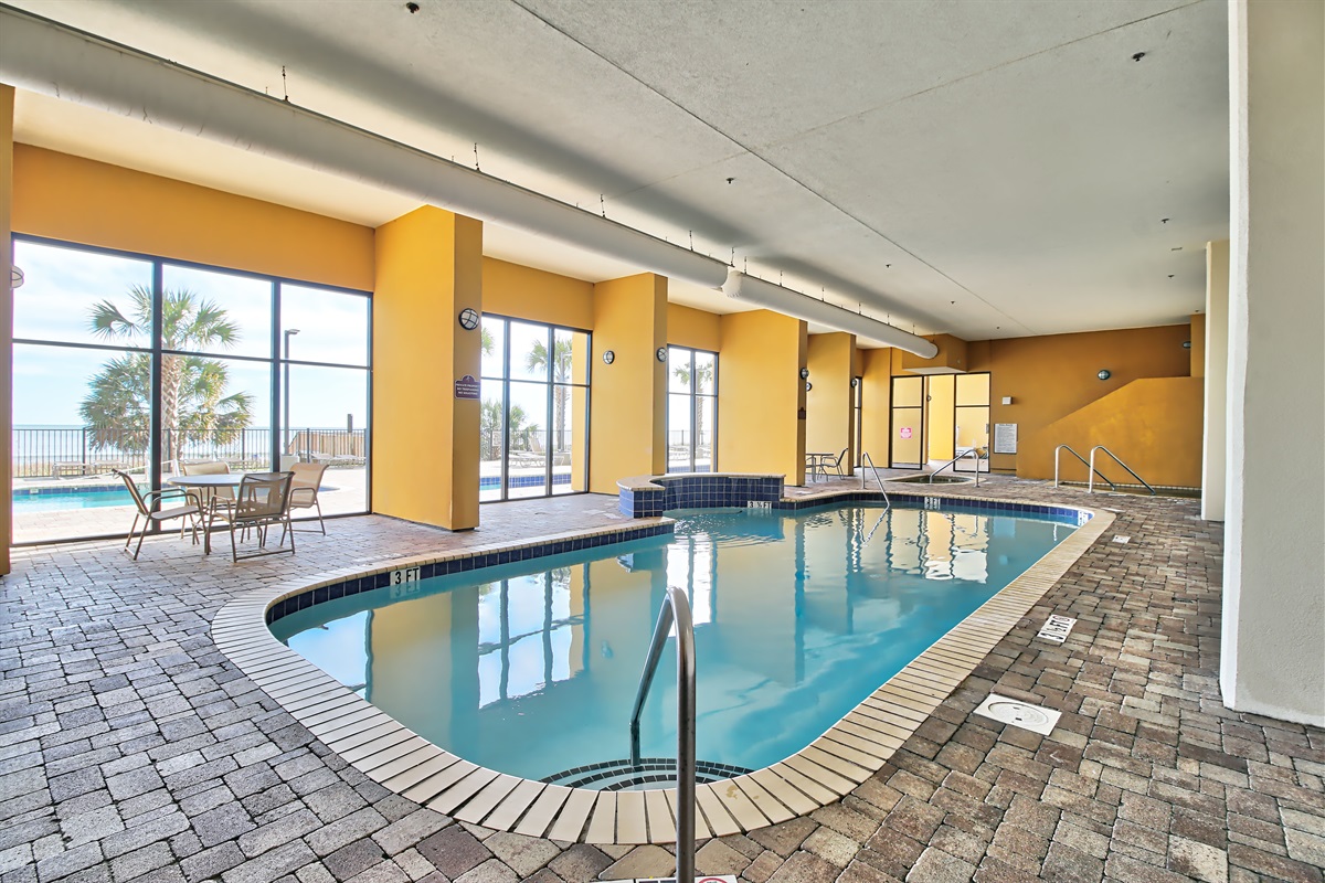 Large indoor pool with waterfall seating