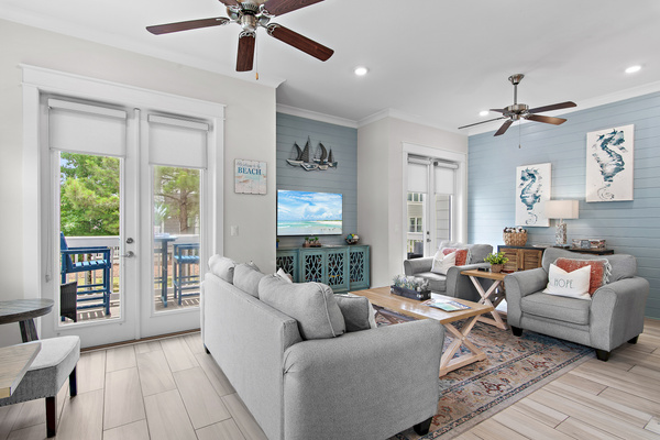 Rest up for a day on the beach in the living room with multiple doors to the wrap around patio
