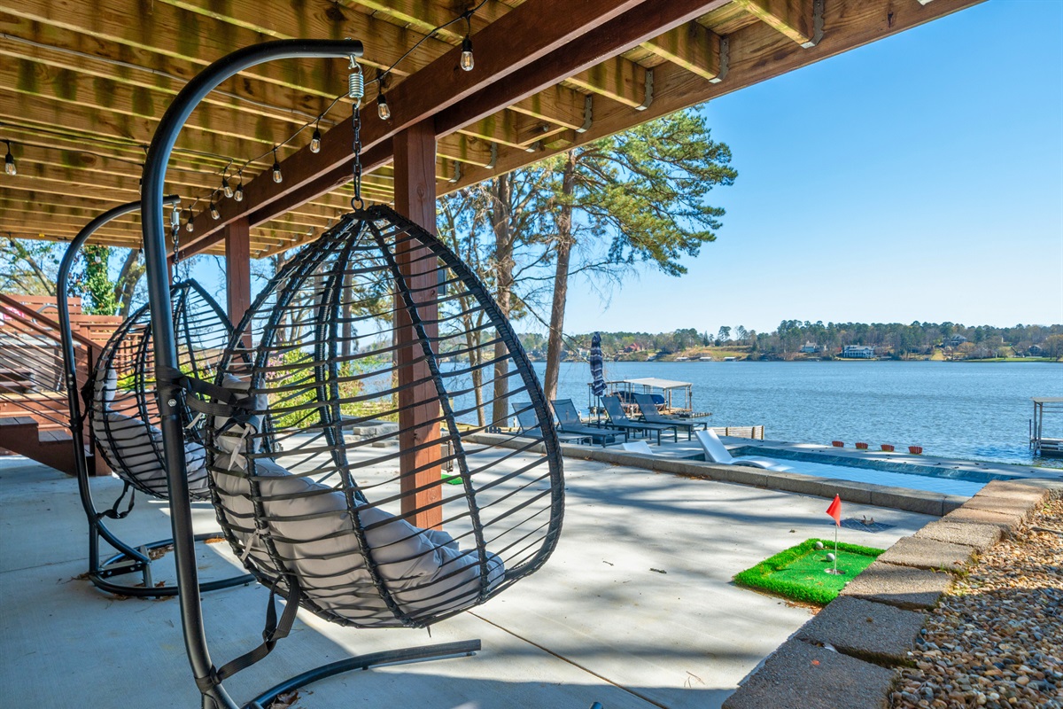 Swing into relaxation on the hanging chairs, a cozy and unique spot to unwind while taking in views of the lake.