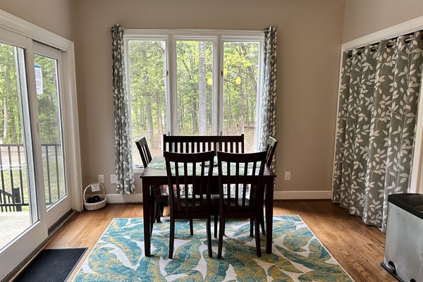 Breakfast Nook with amazing view of the wooded area and down to the lake