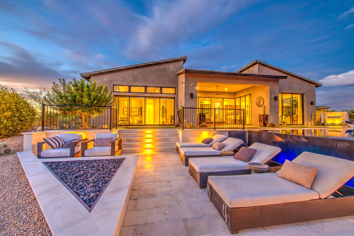 This upscale home has plenty of outdoor seating for everyone.