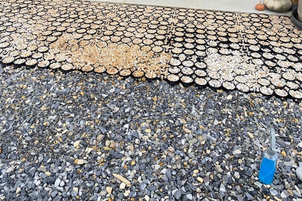Front door detail of stabilized gravel & cement porch.