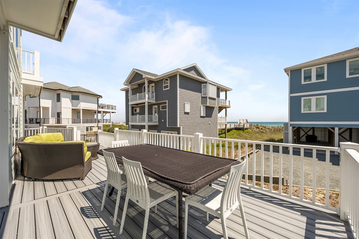 Comfortable polywood bar chairs facing the ocean