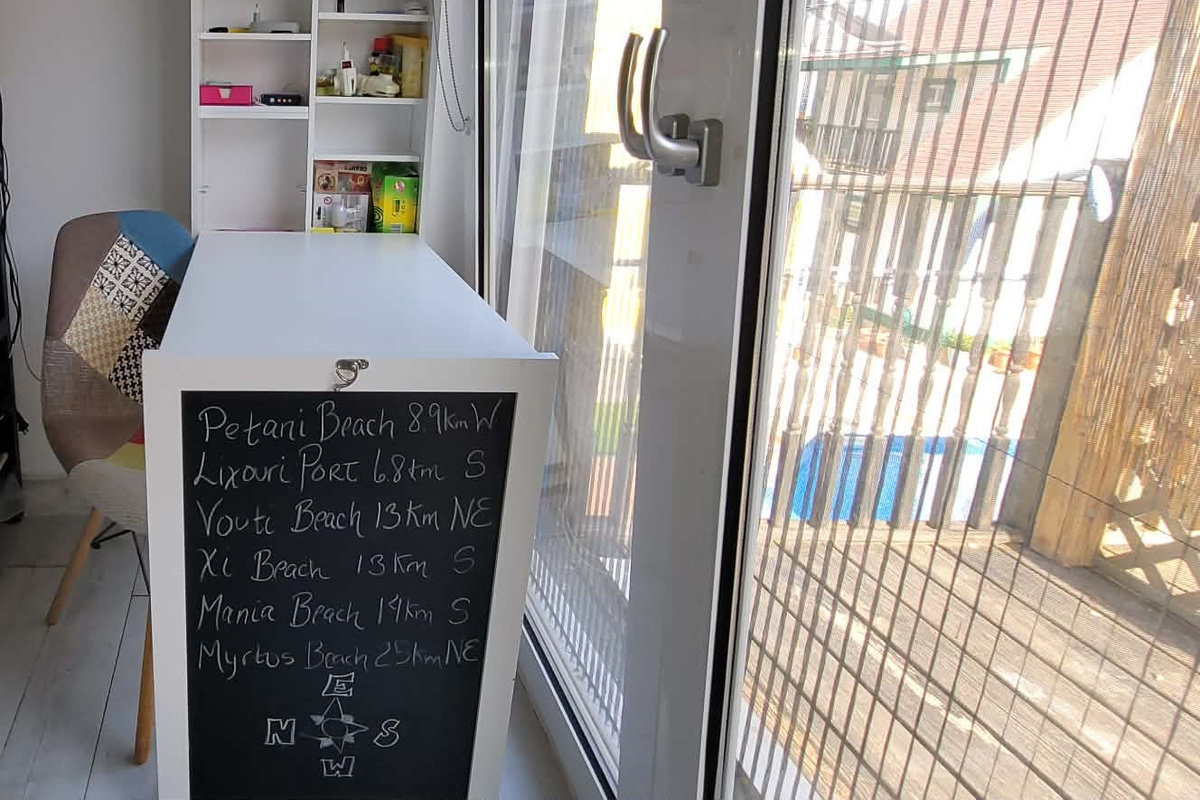 In the shared area, Emergency supplies cabinet converts into a desk workspace. Converted desk workspace, location of the First Aid Kit and other emergency supplies