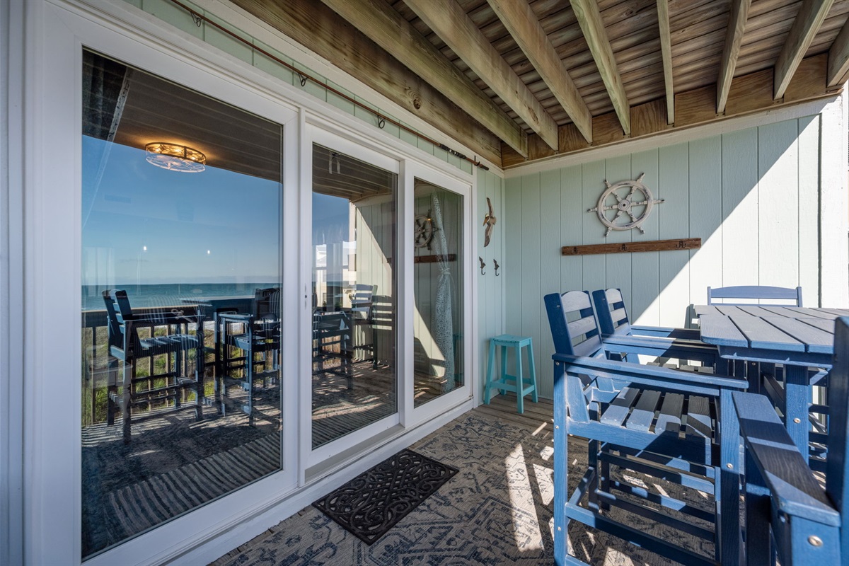 Covered balcony offers shade and comfort all day long