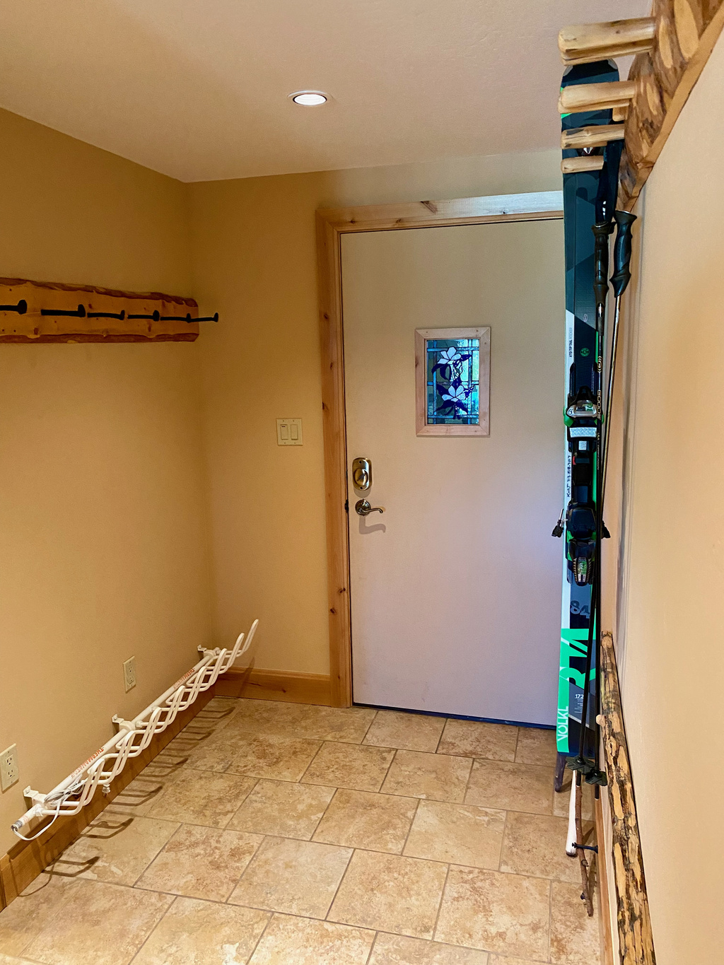 Ski storage and boot dryer in entryway