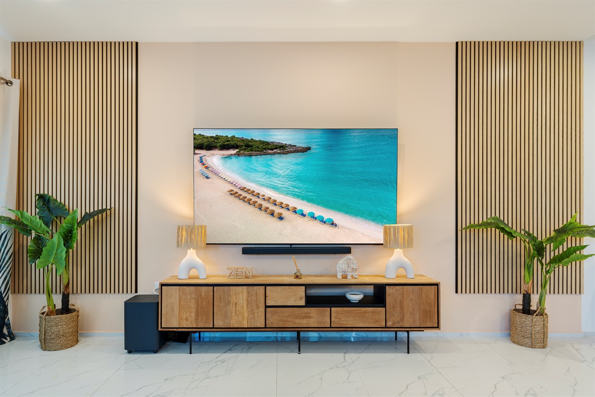 Stream your favorites on the massive 85" Samsung Smart TV with premium sound