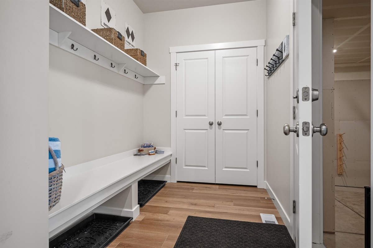 Drop your gear and get cozy—mudroom entry from the garage offers bench seating, boot storage, and coat hooks to keep things tidy.
