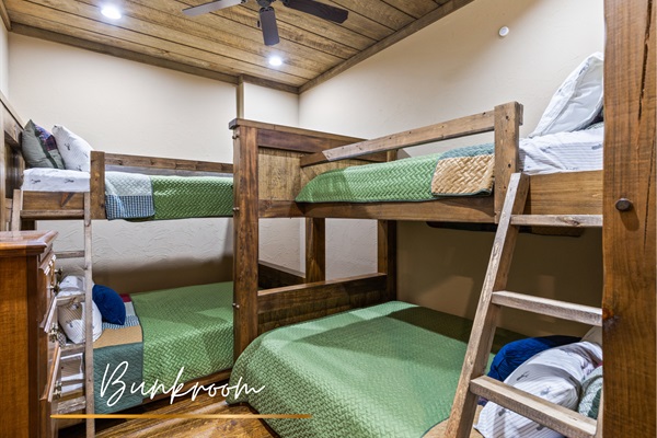 A bunkroom that’s perfect for group fun, featuring two sets of twin-over-queen bunks with plenty of space for everyone to relax and recharge.