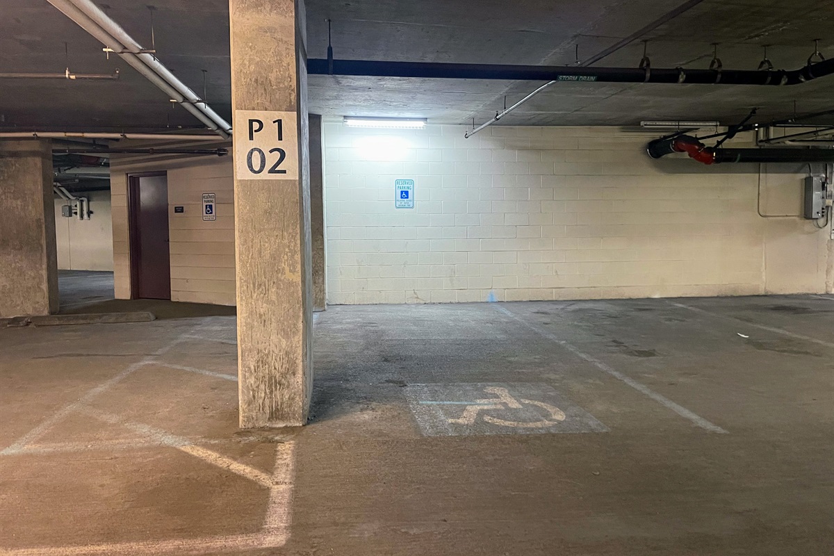 Secure underground garage parking includes designated accessible spaces and e-vehicle charging for added convenience.