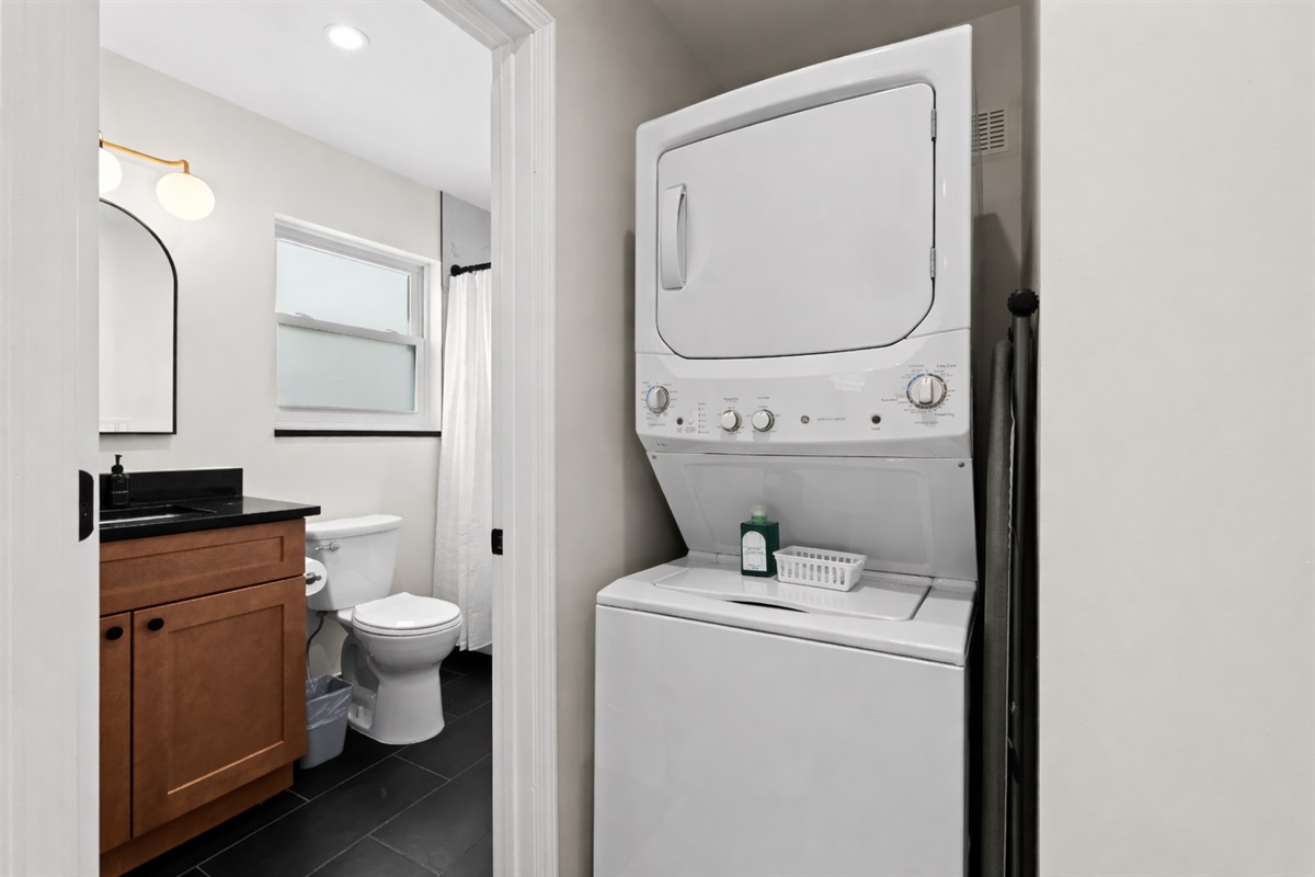 Convenient in-unit laundry tucked beside the bathroom—making everyday chores easy, efficient, and stress-free during your stay.