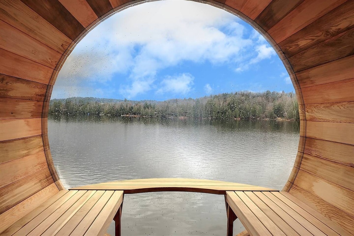 Summertime view of Lac McGregor from interior of sauna
