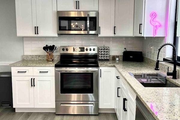 Equipped with brand-new stainless steel appliances, this kitchen is perfect for cooking your favorite meals #instagramWorthy #springhillairbnb #stylishstay