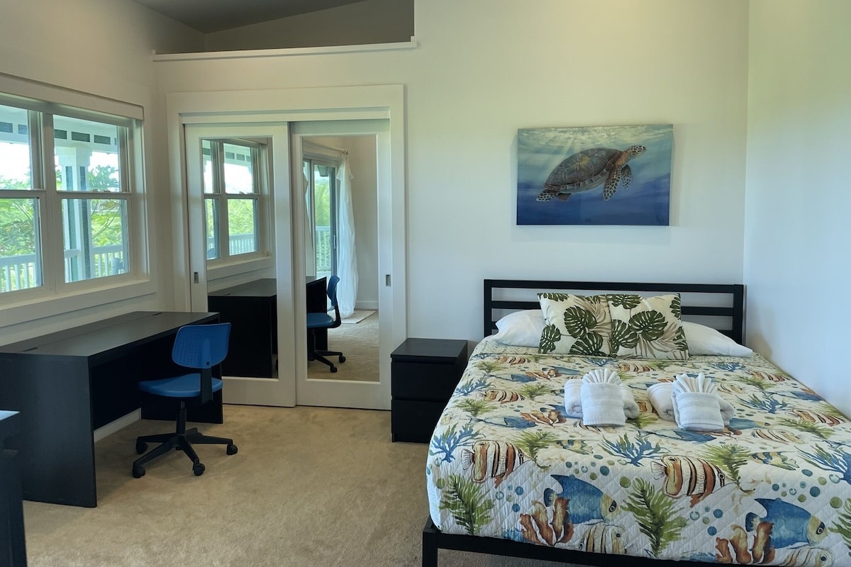 Ocean bedroom with a dedicated workspace.