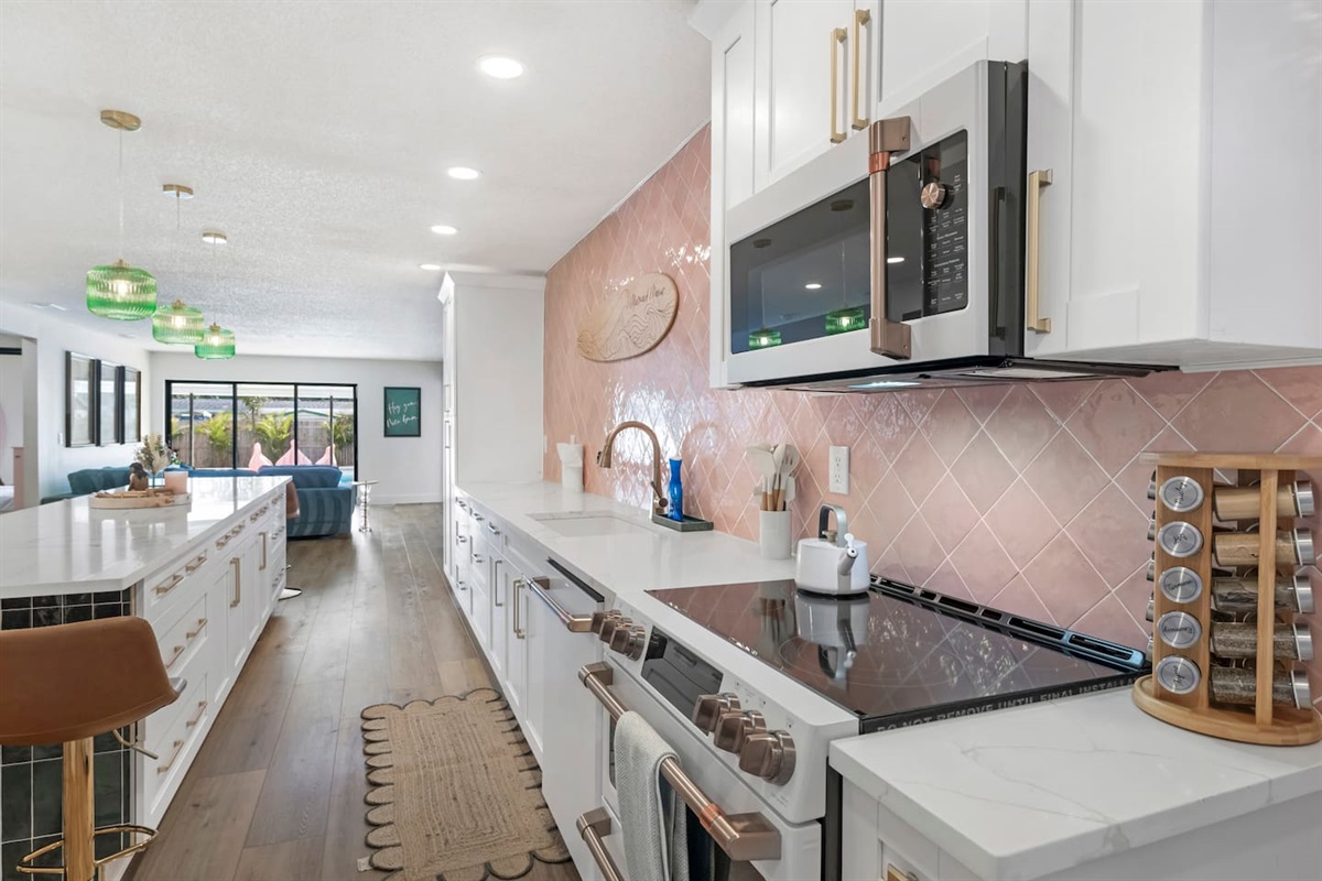 Newly remodeled luxury kitchen with GE Cafe Appliances and quartz counter tops. 