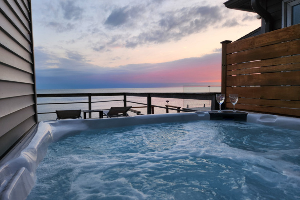 Unwind in the hot tub with unforgettable evening views.