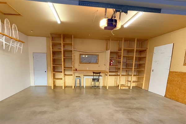 2 car attached garage with EV charger inside and RV hookups outside.