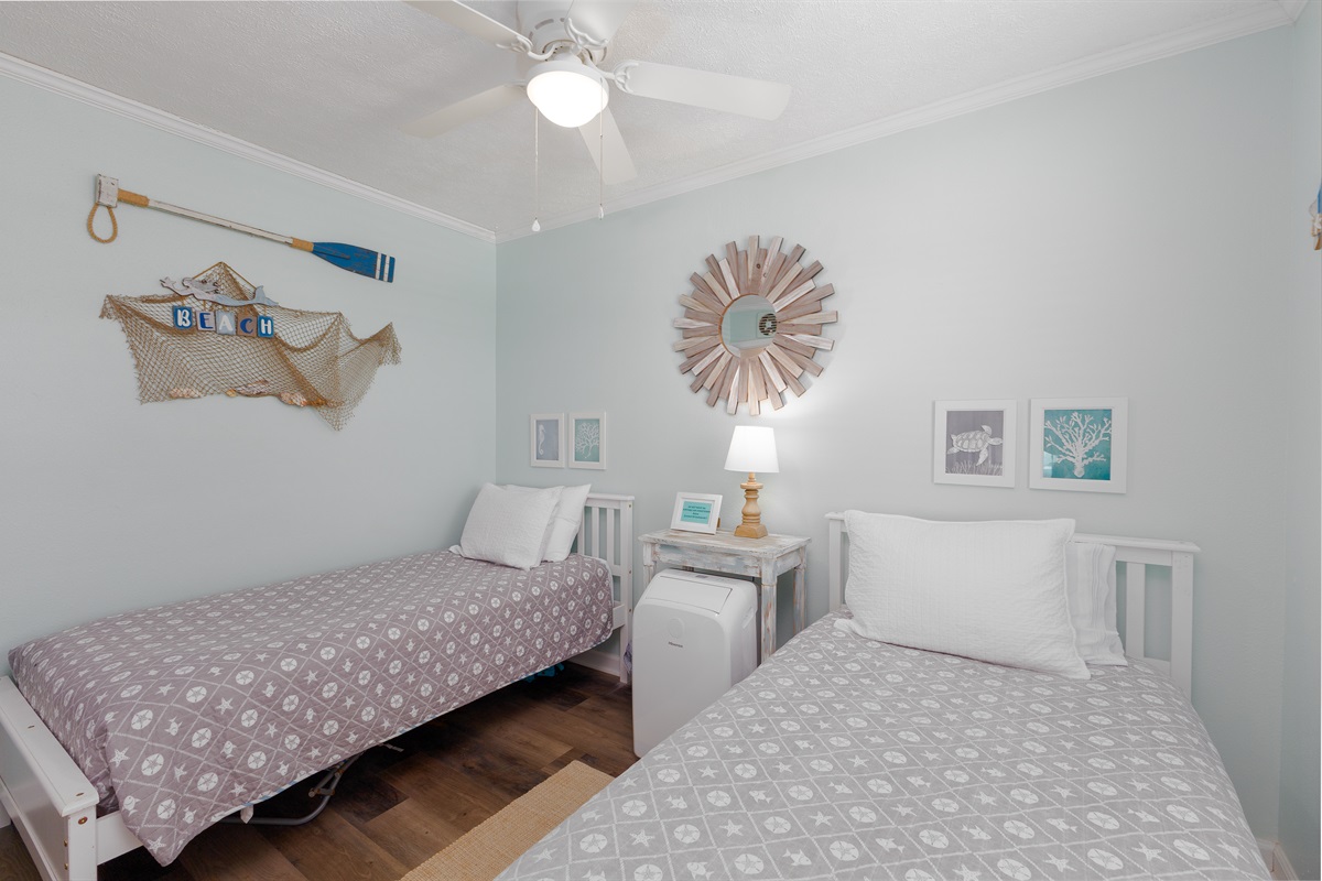 Coastal-themed second bedroom
