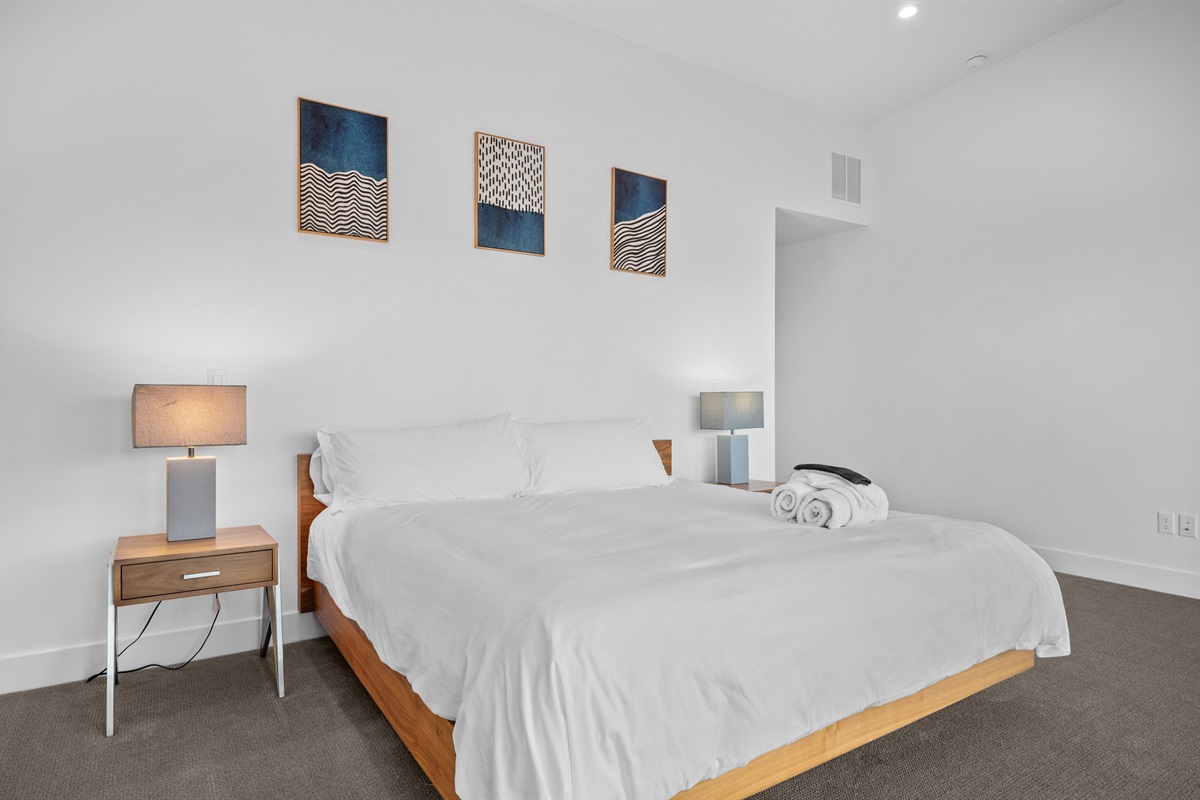 Wake up refreshed in this peaceful king bedroom.