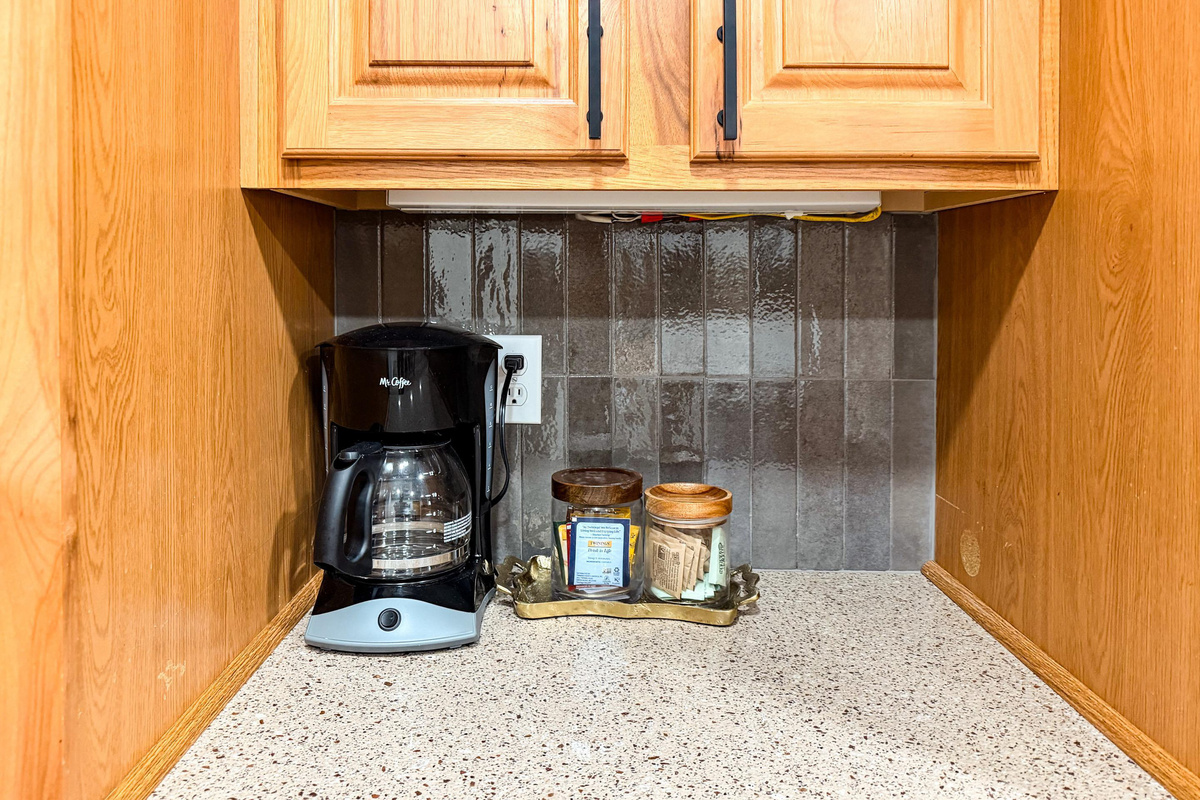 Standard drip coffee maker with filters are provided for guests