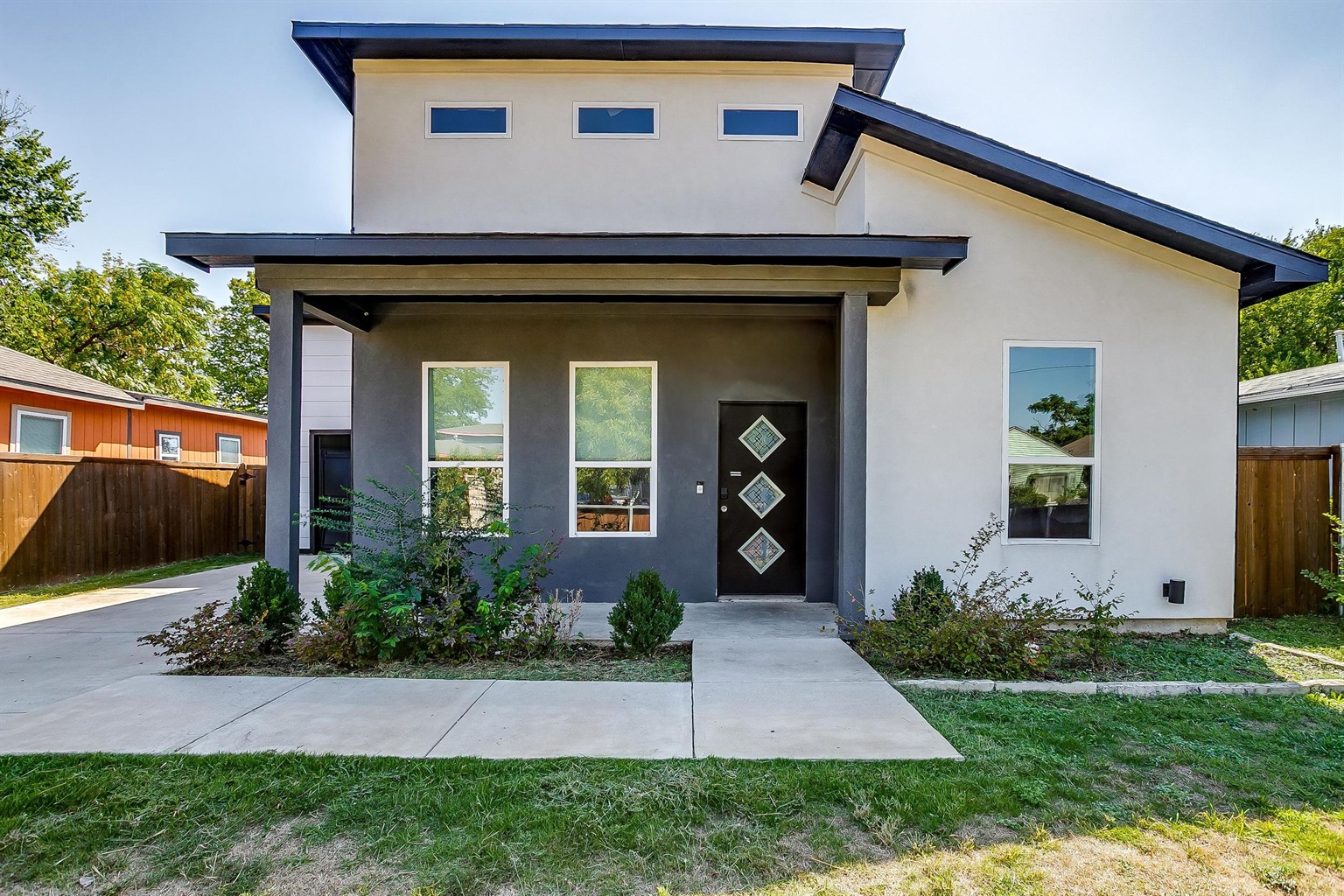 Bright front entrance welcomes you home in the heart of Dallas.