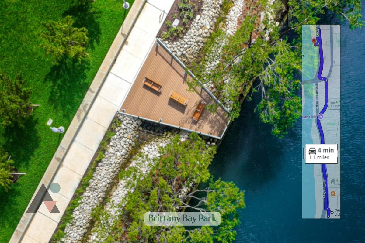 Brittany Bay Park is a peaceful neighborhood park located along the scenic Indian Creek waterway. It features a paved walking path, green grassy lawns, outdoor fitness equipment, and shade trees.