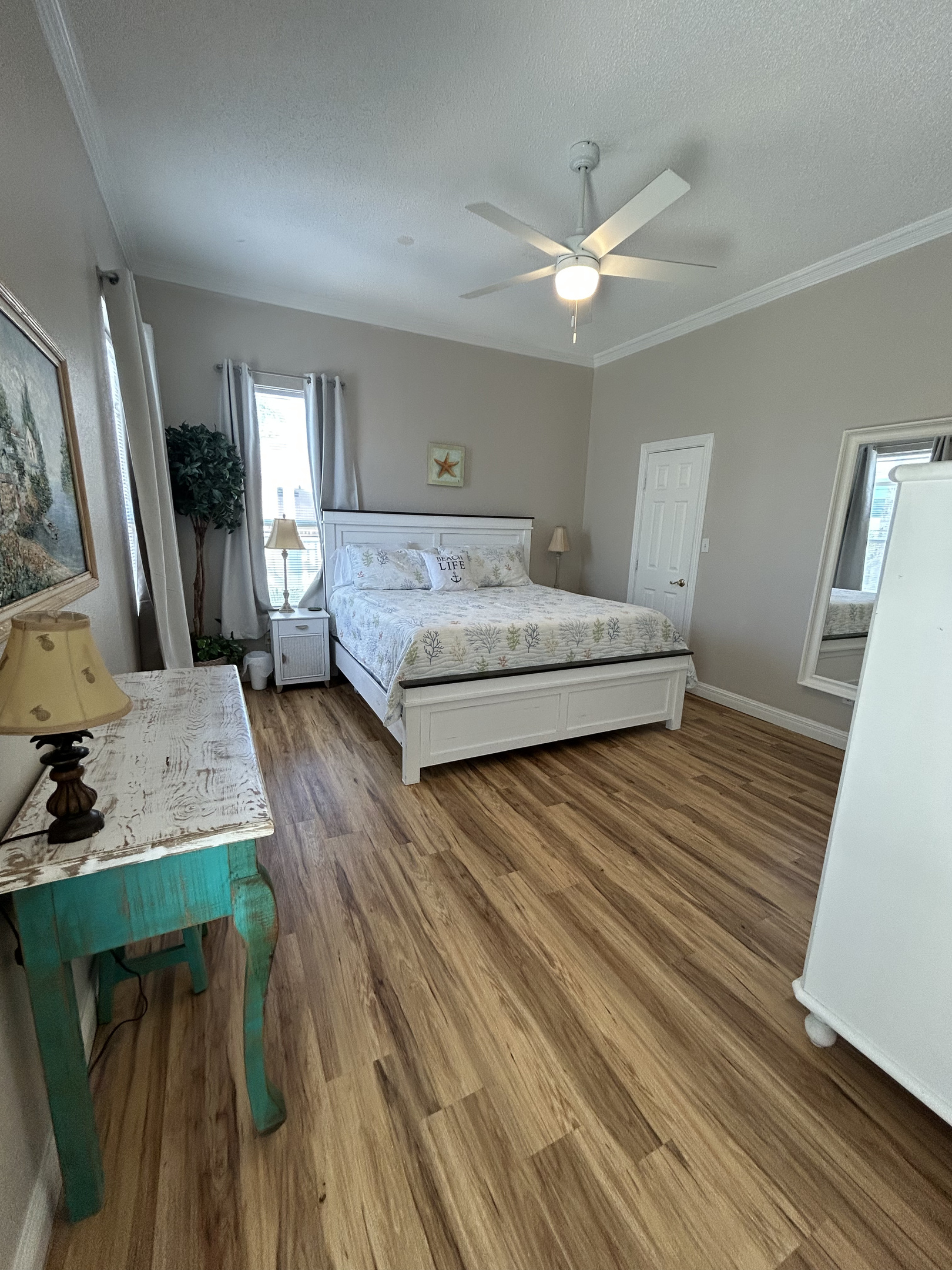 King Suite with ensuite bath and direct balcony access overlooking the tropical backyard oasis. (second-level).