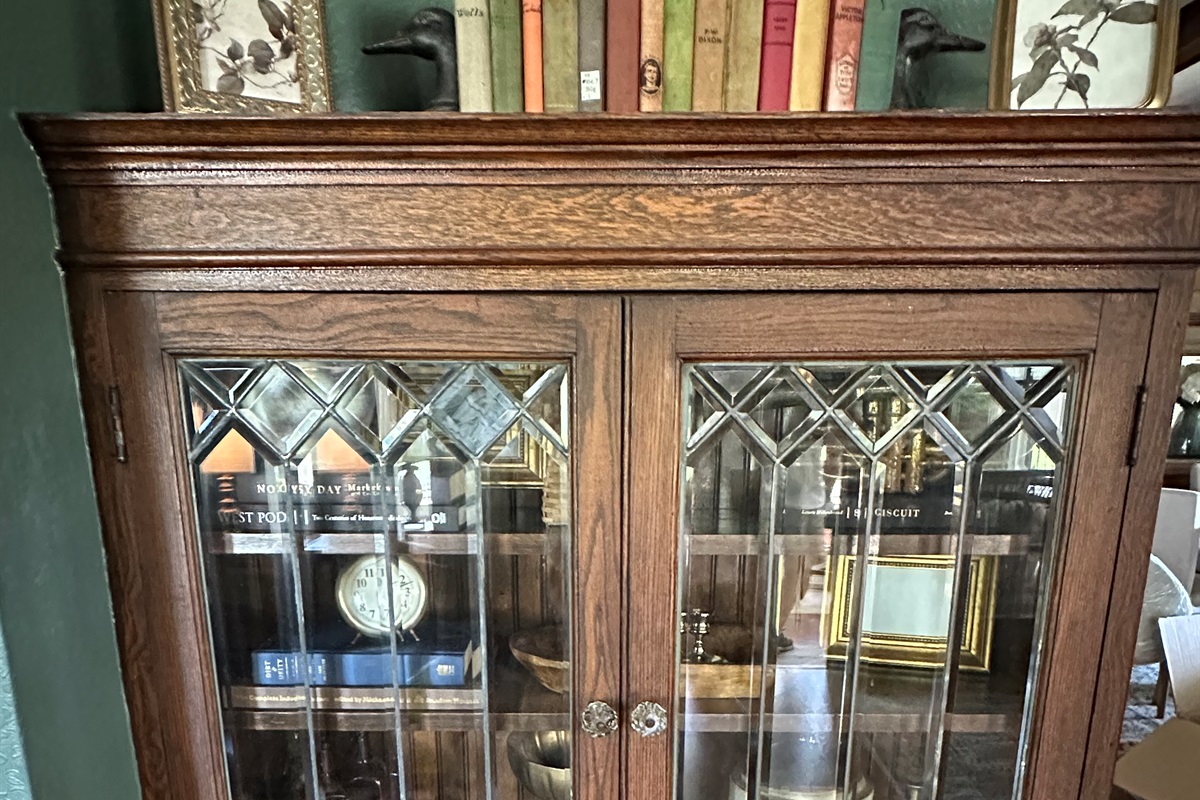 Original leaded glass built ins and warm woodwork add timeless charm throughout Friday Farm. Thoughtfully styled spaces blend historic character with modern comfort for a stay that feels both elegant and inviting.