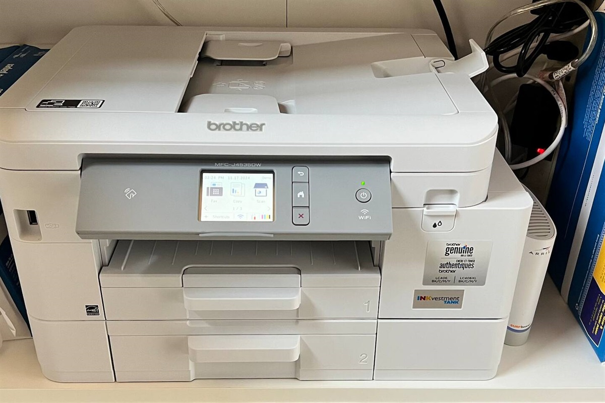 Brand-new Brother MFC-J4535DW printer/scanner/copier conveniently located near the workspace. Perfect for business travelers or remote workers needing reliable printing, scanning, and copying during their stay.