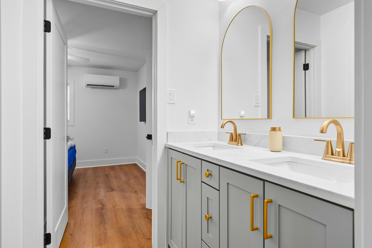 With its double vanity and spacious layout, this bathroom offers plenty of room for guests to get ready comfortably.