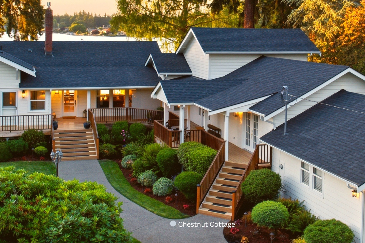 Chestnut Cottage is the right-hand residence, with its own staircase, private entrance + front/back deck. Chestnut is attached along only an eight-foot section between both living rooms, with three separate walls between them for enhanced sound mitigation.