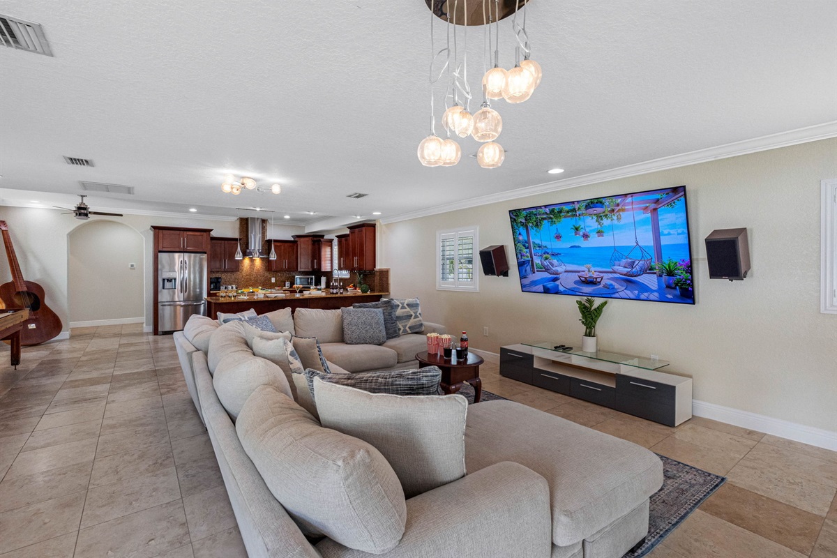 This welcoming space features a spacious, plush sectional sofa, perfect for stretching out and relaxing after a day of exploring, swimming, or sightseeing.
